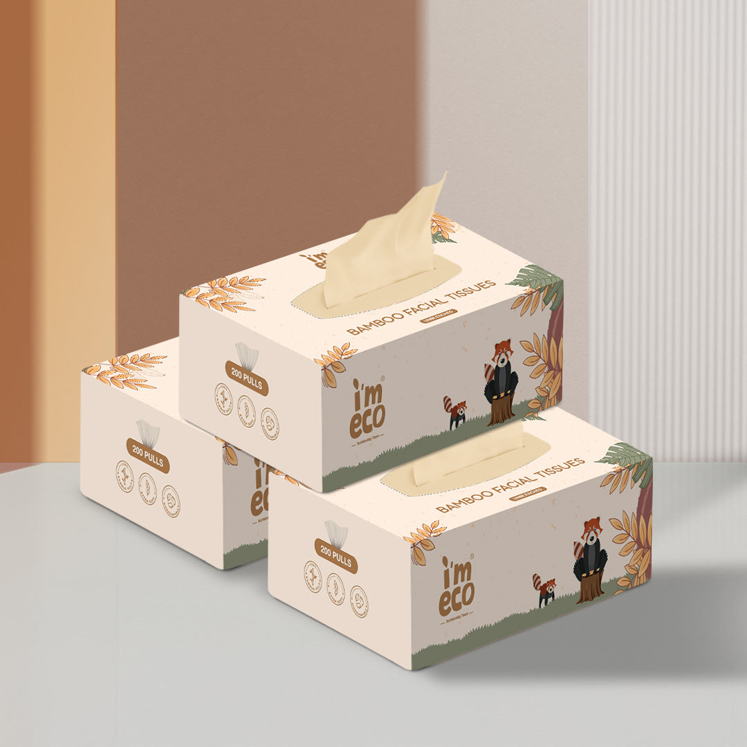 Boxes of bamboo facial tissues are placed on a white base with tissues protruding out.