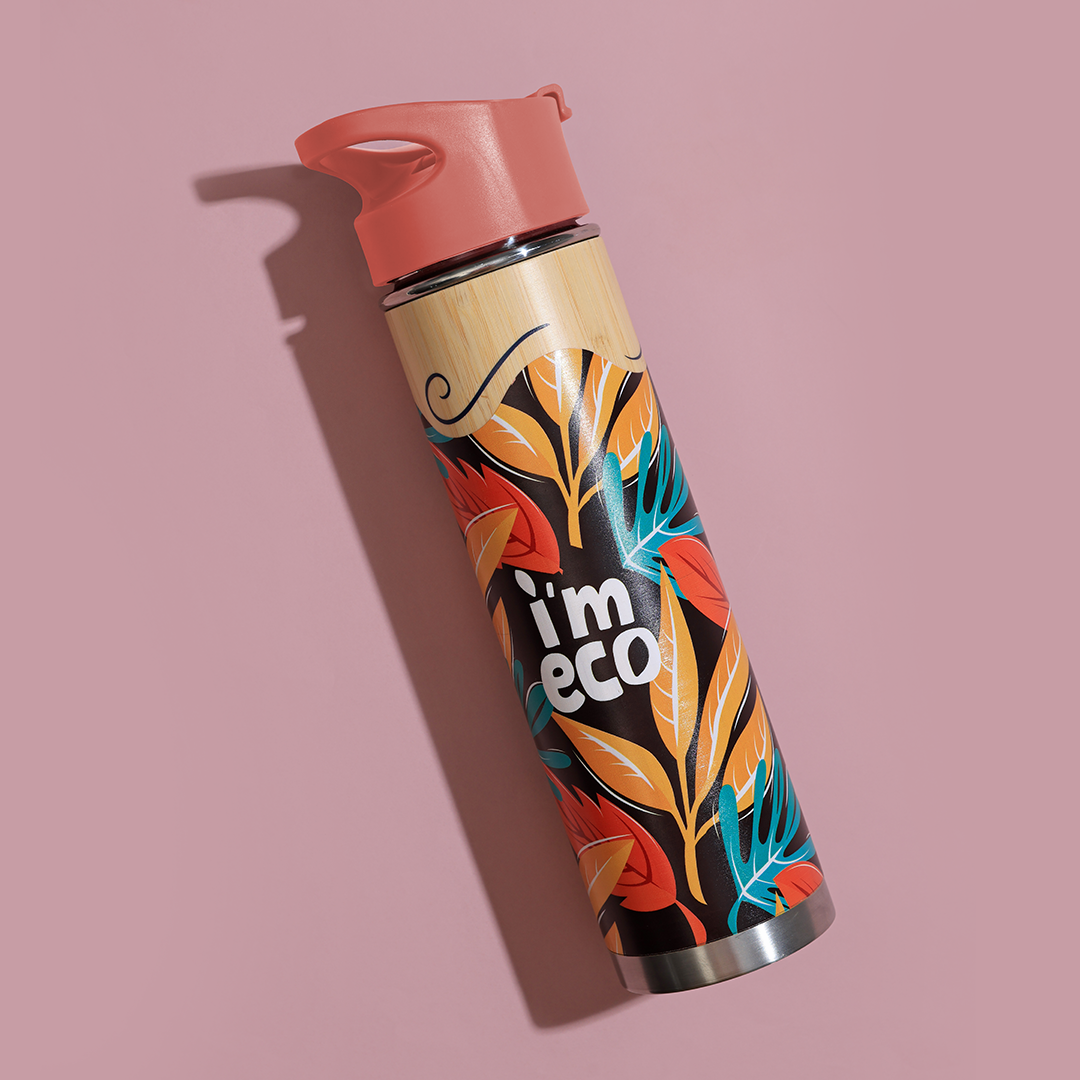 Red printed bamboo water bottle in a pink background.