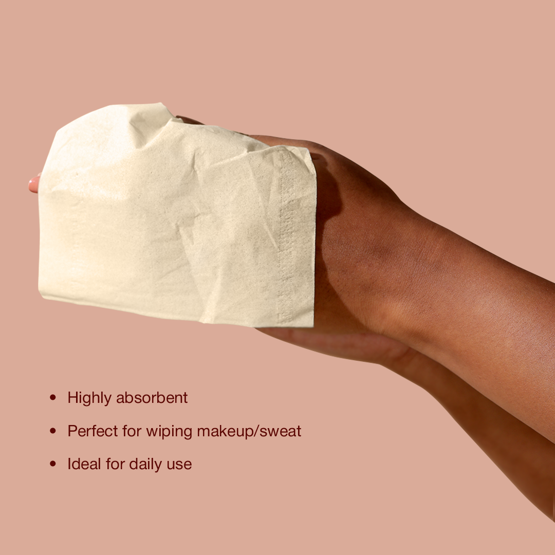 A person holding highly absorbent bamboo facial tissue and features displayed.