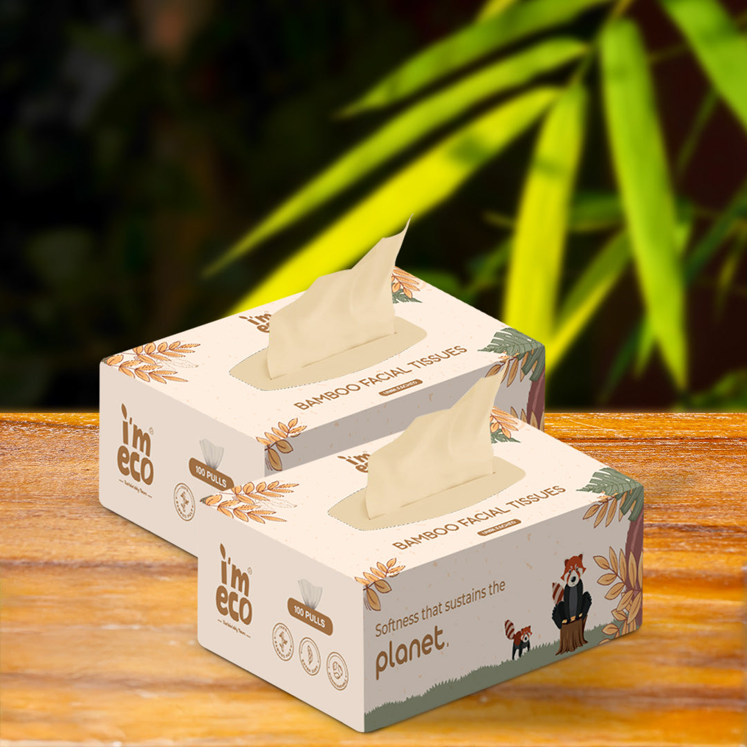2 boxes of bamboo facial tissues are placed on a wooden base with a part of tissue shown.