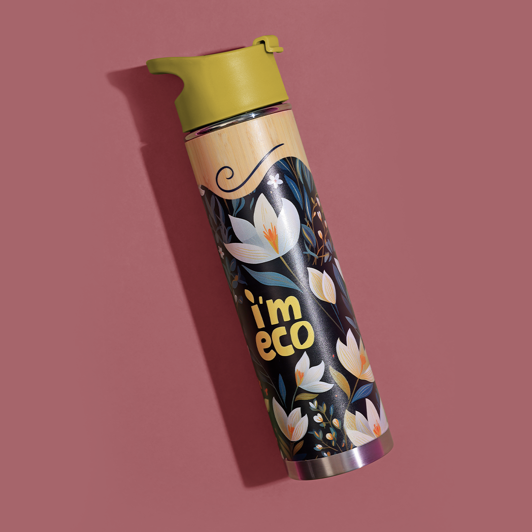 A yellow printed bamboo water bottle placed in a pink background.