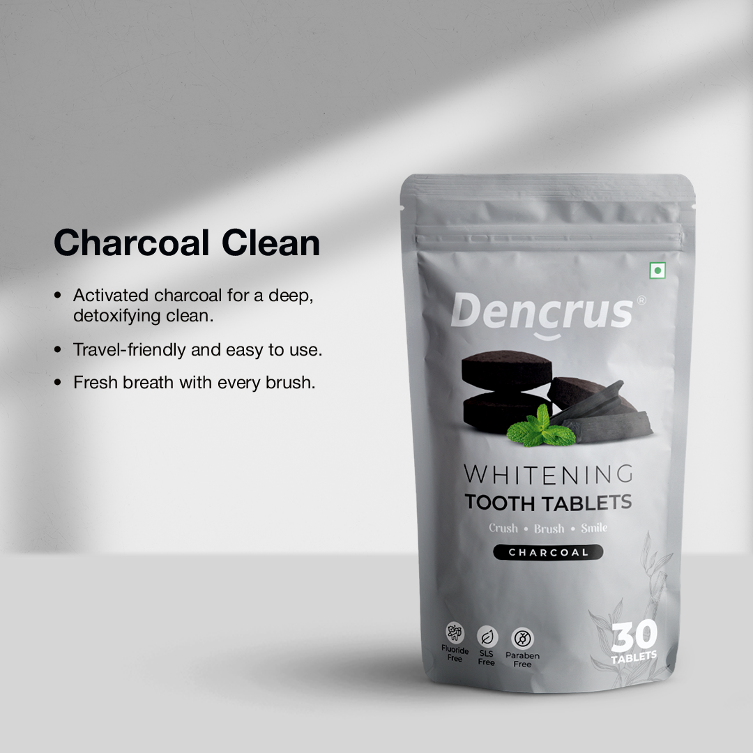 A package of Dencrus whitening tooth tablets with charcoal flavor displayed on white surface against a white background