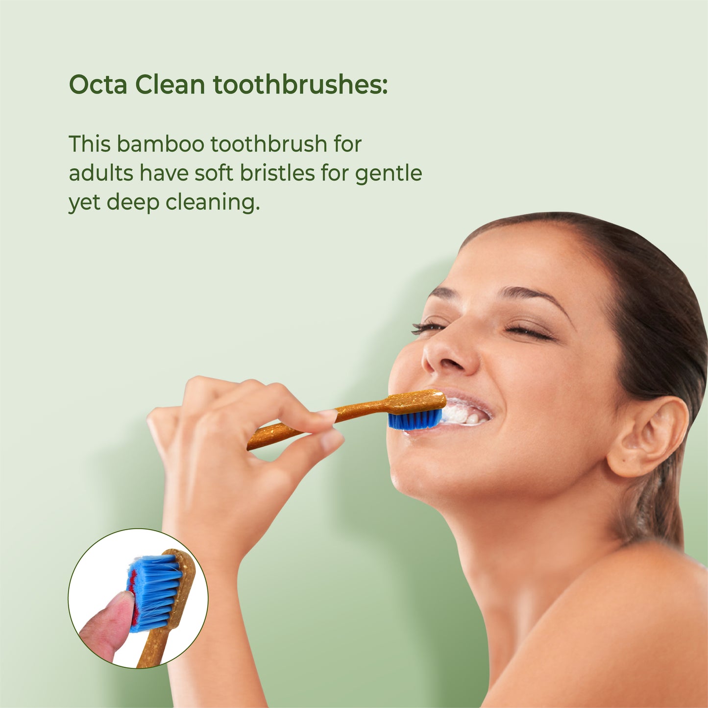 a woman brushing her teeth with octa clean bamboo toothbrush on a green background