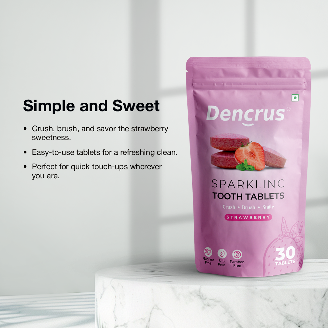 A package of Dencrus Strawberry tooth tablets is placed on a round textured stone against a white background highlighting the key features
