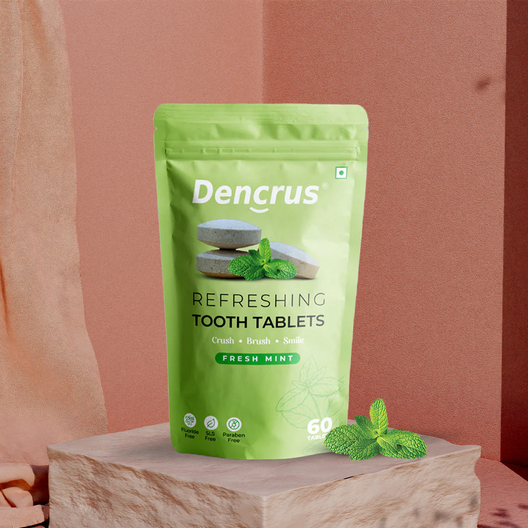 A package of Dencrus toothpaste tablets with the flavor fresh mint. The packaging is green with an image of the tablets, mint leaves, and the number 30 indicating the quantity.