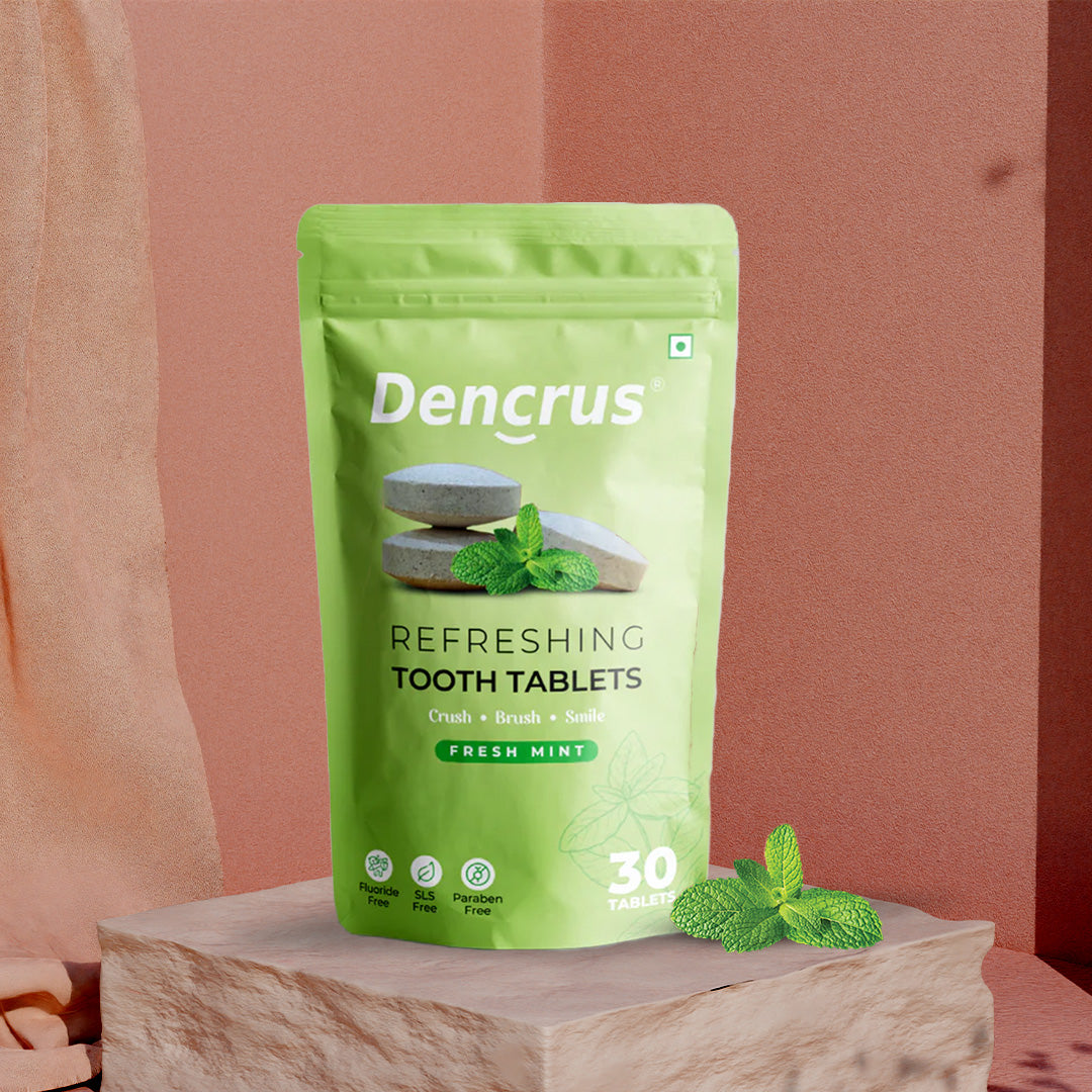 A package of Dencrus toothpaste tablets with the flavor fresh mint. The packaging is green with an image of the tablets, mint leaves, and the number 30 indicating the quantity.