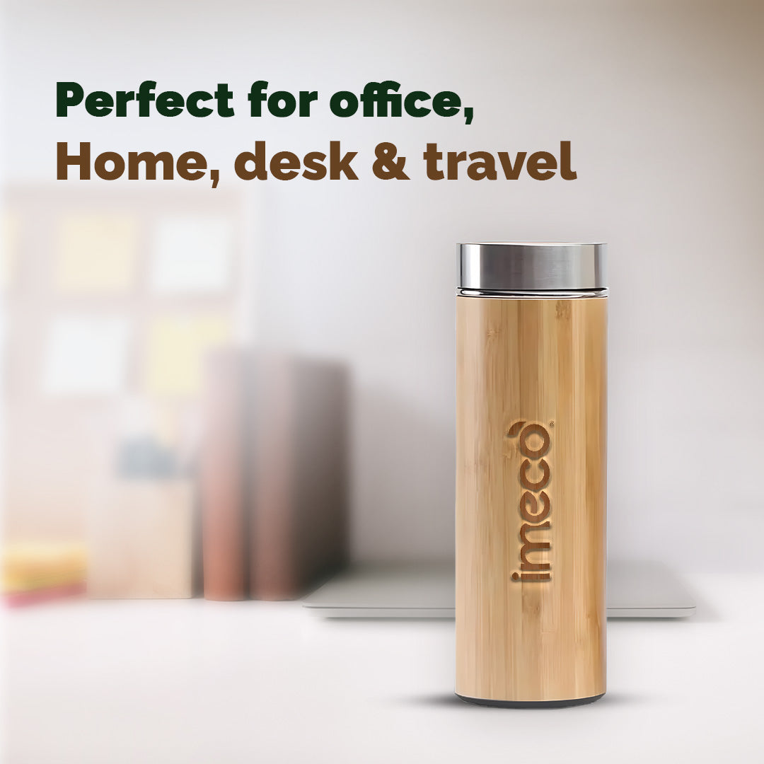 IMECO Bamboo Flat lid water bottle with stainless steel lid on a blurred office background, featuring the brand 'imeco'.