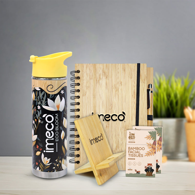 imeco bamboo desk essentials including bamboo bottles, bamboo mobile stand, bamboo pocket tissues and bamboo diary against a blurred background