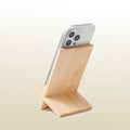 imeco bamboo phone stand holding a smartphone on a light beige background