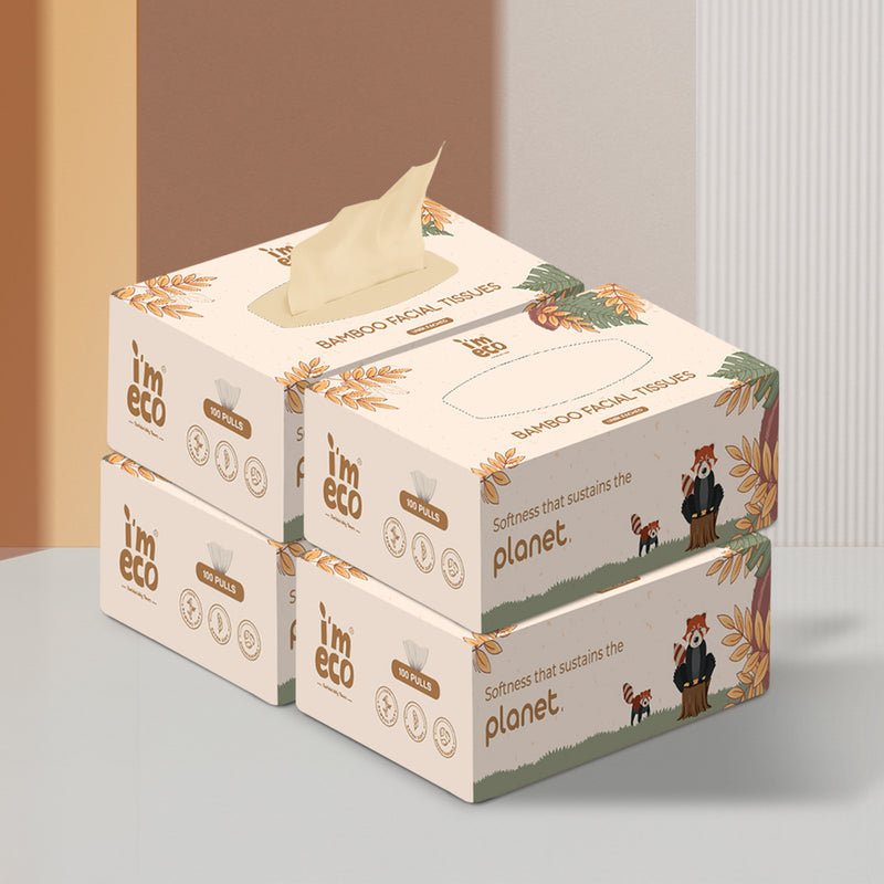 4 boxes of bamboo facial tissues placed on a white base with one of them having a pull-out visible.