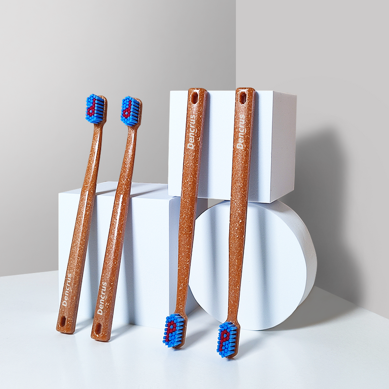 4 bamboo toothbrush with 2 of them placed upside down. The background is white.