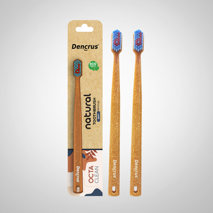 Bamboo toothbrushes with blue and red bristles, packaged in a cardboard casing with 'dencrus' and 'natural octa clean' branding.
