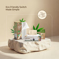 eco friendly products including tissues, kitchen towel, and straws on a stone surface with a beige background.