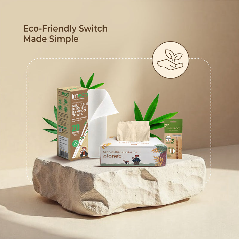 eco friendly products including tissues, kitchen towel, and straws on a stone surface with a beige background.