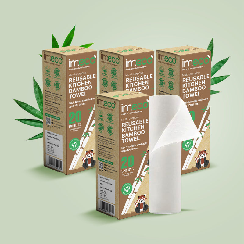 4 boxes of imeco reusable kitchen bamboo towels on a light green background with bamboo leaves.
