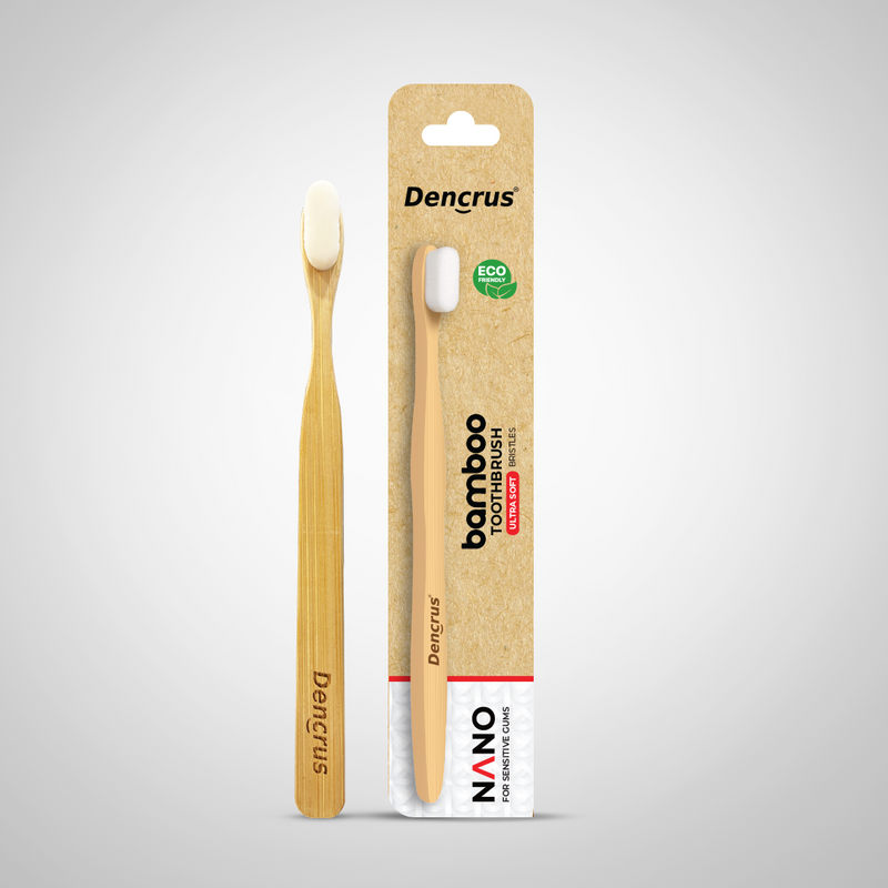 A Dencrus NANO Toothbrush with the packaging placed against a white background. 