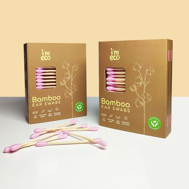 Two packaging of IMECO Bamboo Cotton Ear Swabs with several pink swabs placed on the outside against a light background