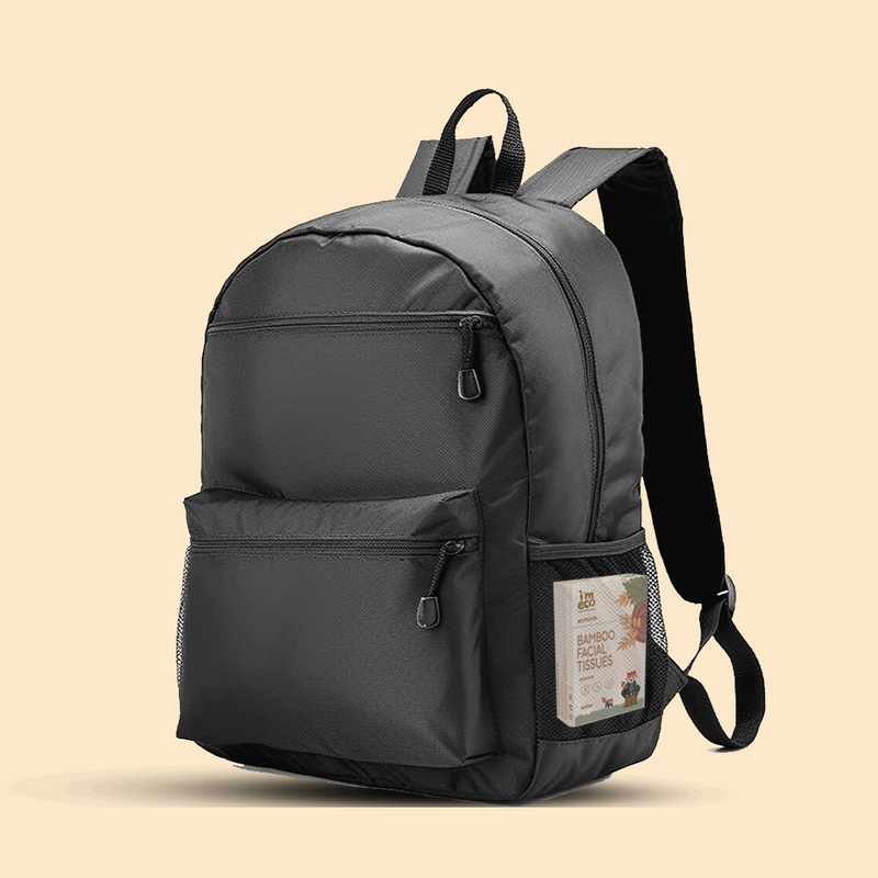 A bag is holding IMECO Pocket Tissues in its side pockets. And the background is white. 