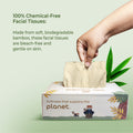 imeco bamboo facial tissues with a hand pulling a tissue, on a light green background.