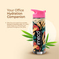 bamboo and stainless steel water bottle with colorful design and pink cap on beige background