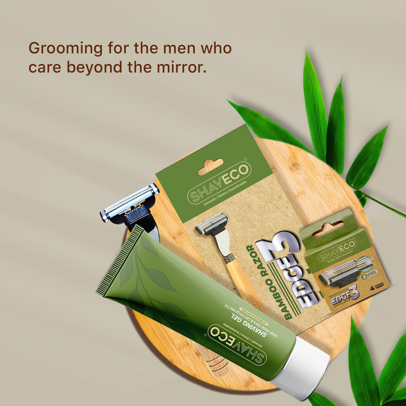 shaveco shaving products including a razor, gel, and packaging on a wooden board with bamboo leaves.